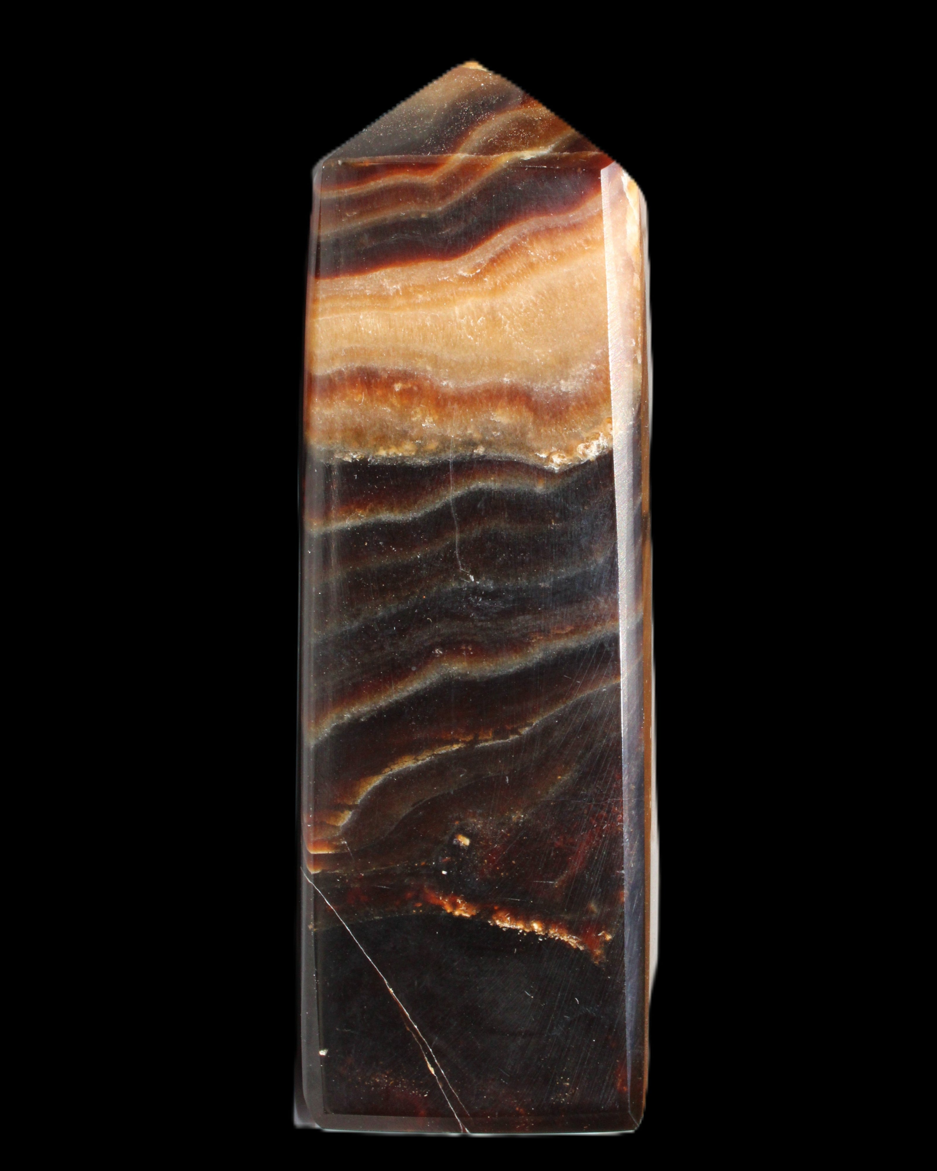 Chocolate Calcite obelisk 103*35mm 268g in sunlight - Rocks and Things Store