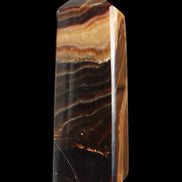 Chocolate Calcite obelisk 103*35mm 268g in sunlight - Rocks and Things Store