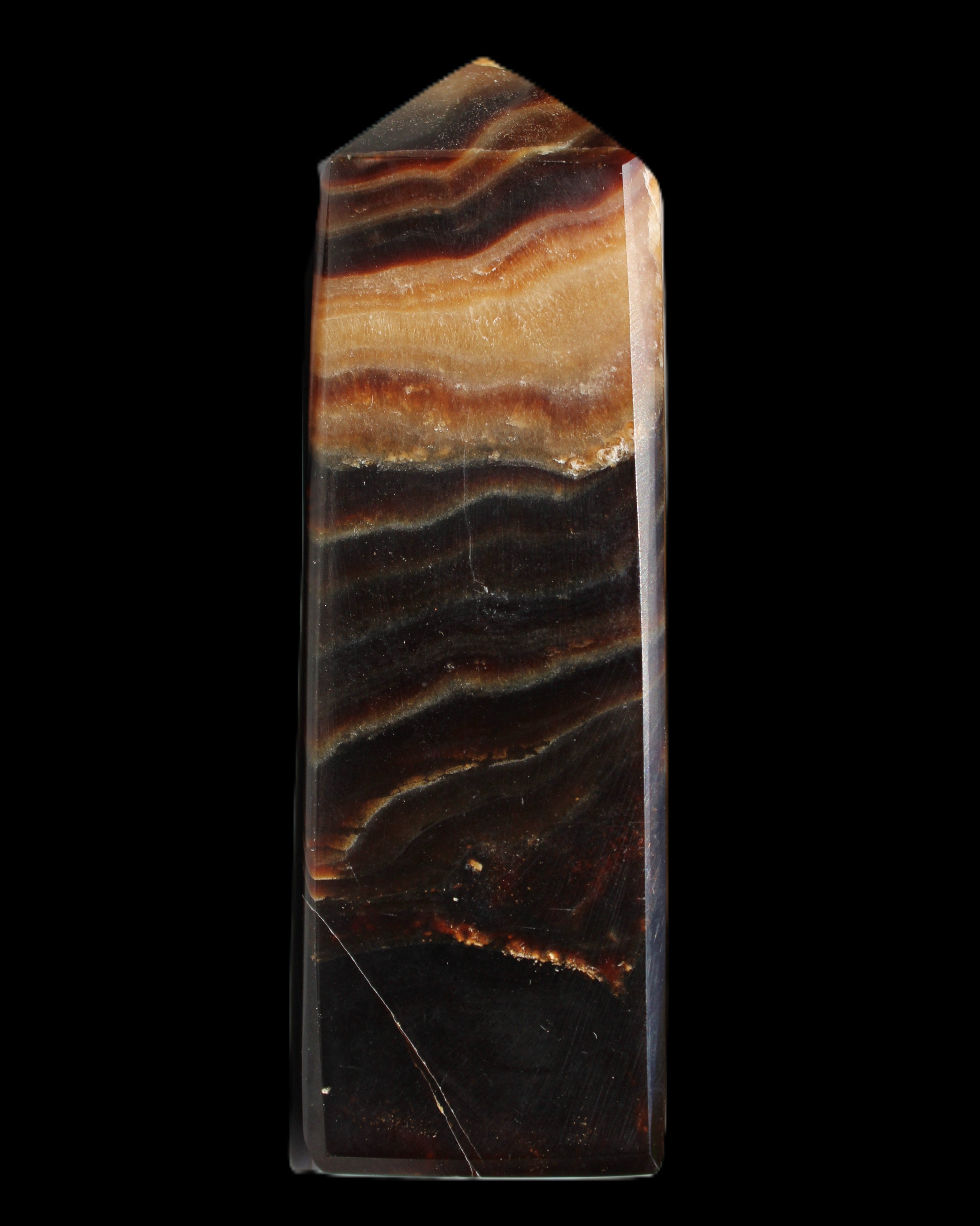 Chocolate Calcite obelisk 103*35mm 268g in sunlight - Rocks and Things Store
