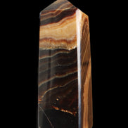 Chocolate Calcite obelisk 103*35mm 268g in sunlight - Rocks and Things Store
