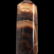 Chocolate Calcite obelisk 103*35mm 268g in sunlight - Rocks and Things Store