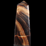 Chocolate Calcite obelisk 103*35mm 268g in sunlight - Rocks and Things Store
