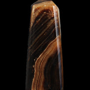 Chocolate Calcite obelisk 103*35mm 268g in sunlight - Rocks and Things Store