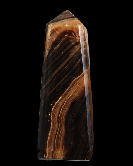 Chocolate Calcite obelisk 103*35mm 268g in sunlight - Rocks and Things Store