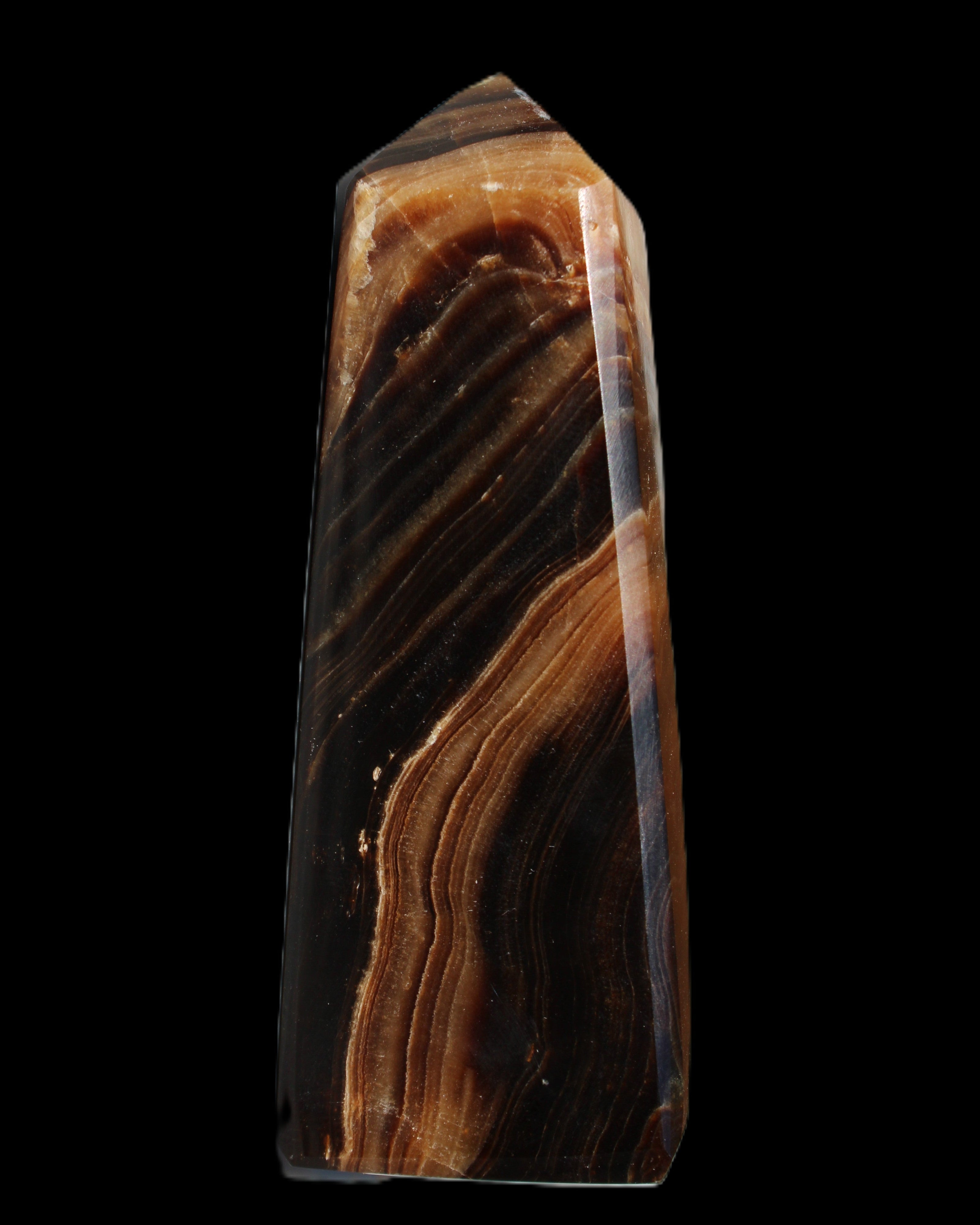 Chocolate Calcite obelisk 103*35mm 268g in sunlight - Rocks and Things Store
