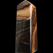 Chocolate Calcite obelisk 103*35mm 268g in sunlight - Rocks and Things Store