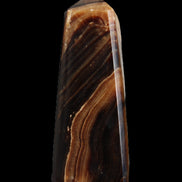 Chocolate Calcite obelisk 103*35mm 268g in sunlight - Rocks and Things Store