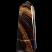 Chocolate Calcite obelisk 103*35mm 268g in sunlight - Rocks and Things Store
