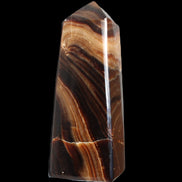 Chocolate Calcite obelisk 103*35mm 268g in sunlight - Rocks and Things Store