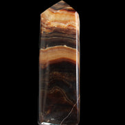 Chocolate Calcite obelisk 103*35mm 268g in sunlight - Rocks and Things Store