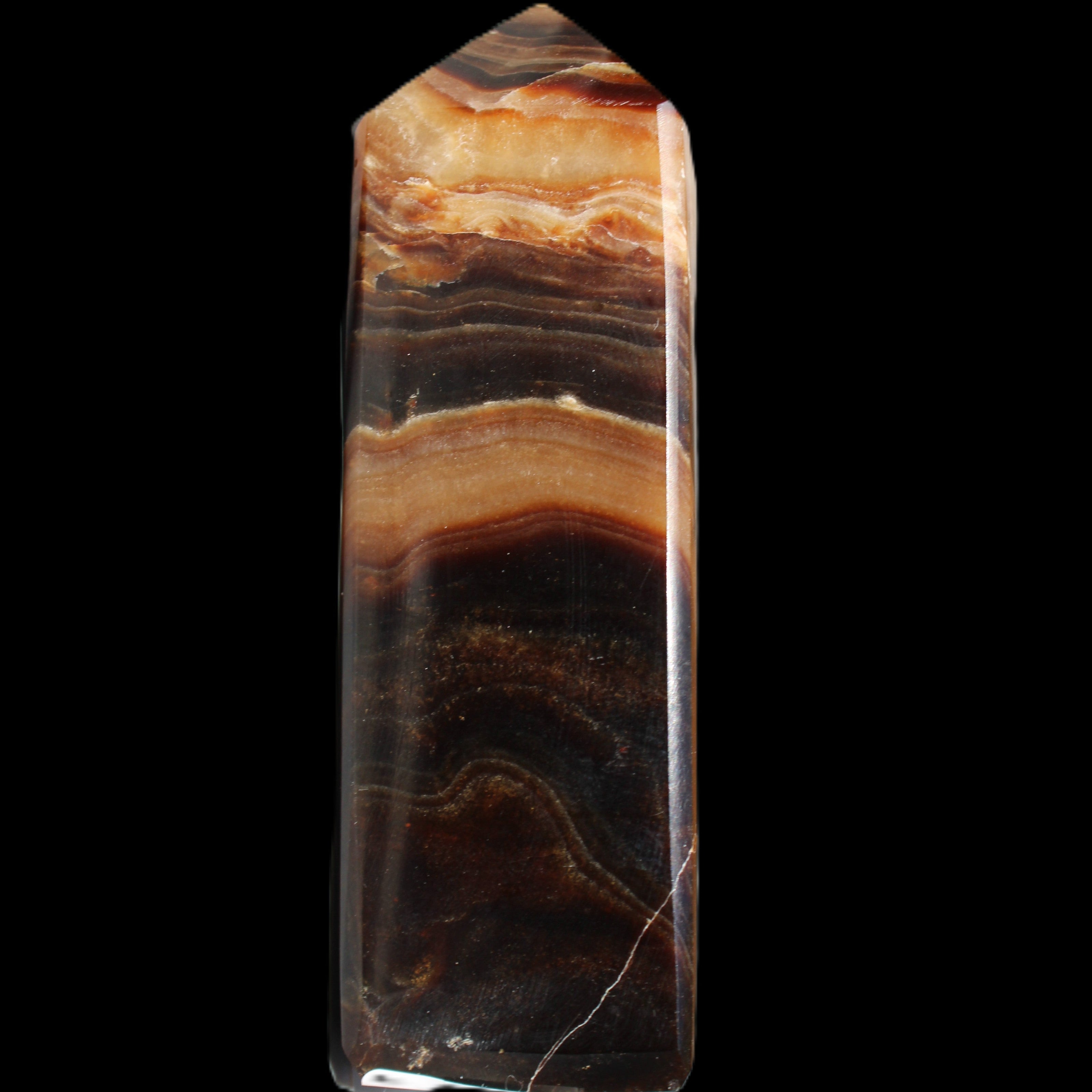 Chocolate Calcite obelisk 103*35mm 268g in sunlight - Rocks and Things Store