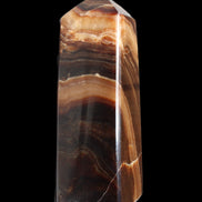 Chocolate Calcite obelisk 103*35mm 268g in sunlight - Rocks and Things Store