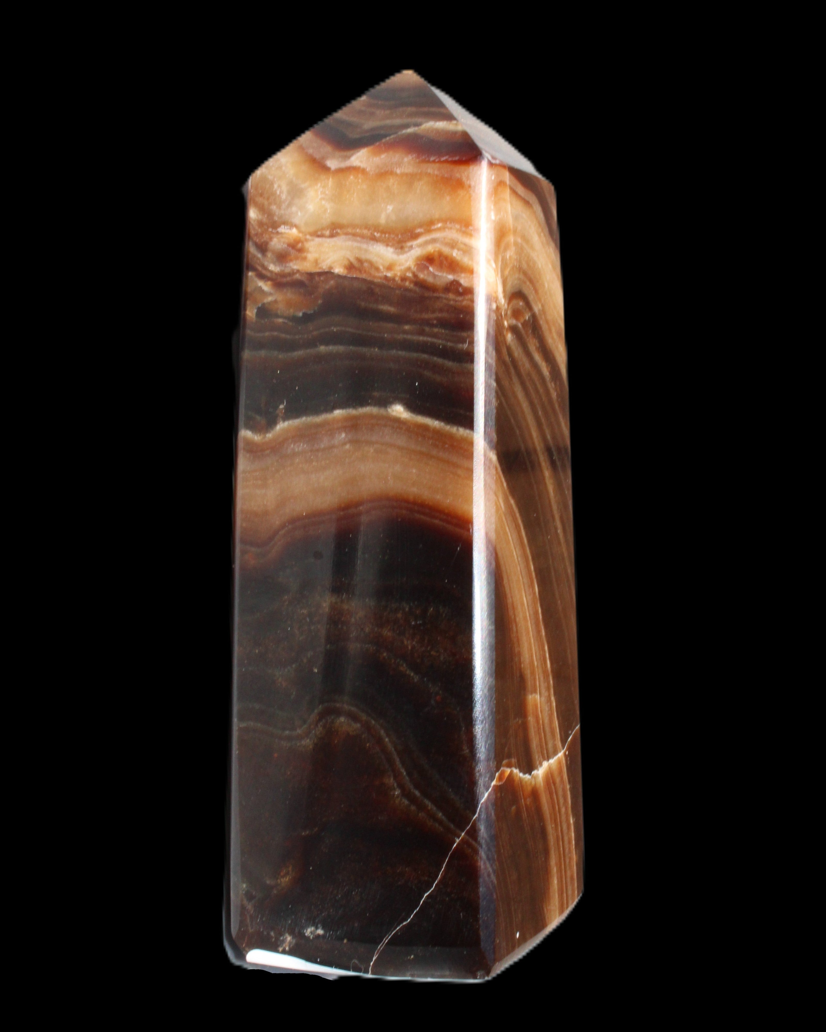 Chocolate Calcite obelisk 103*35mm 268g in sunlight - Rocks and Things Store