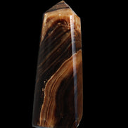 Chocolate Calcite obelisk 103*35mm 268g in sunlight - Rocks and Things Store
