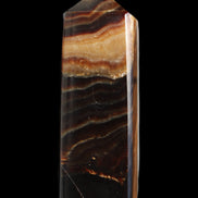 Chocolate Calcite obelisk 103*35mm 268g in sunlight - Rocks and Things Store