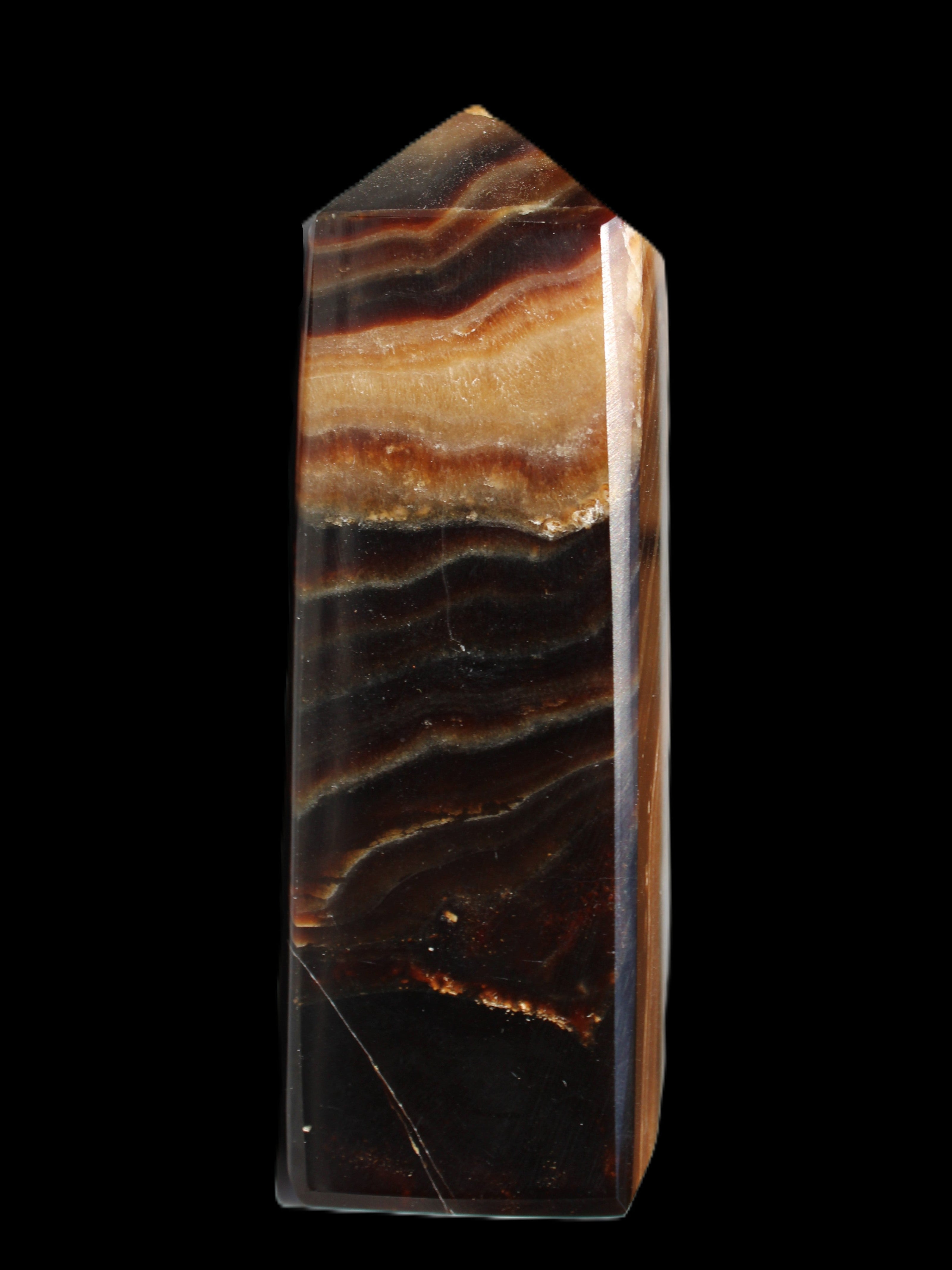Chocolate Calcite obelisk 103*35mm 268g in sunlight - Rocks and Things Store