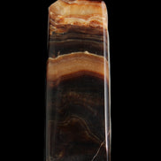 Chocolate Calcite obelisk 103*35mm 268g in sunlight - Rocks and Things Store