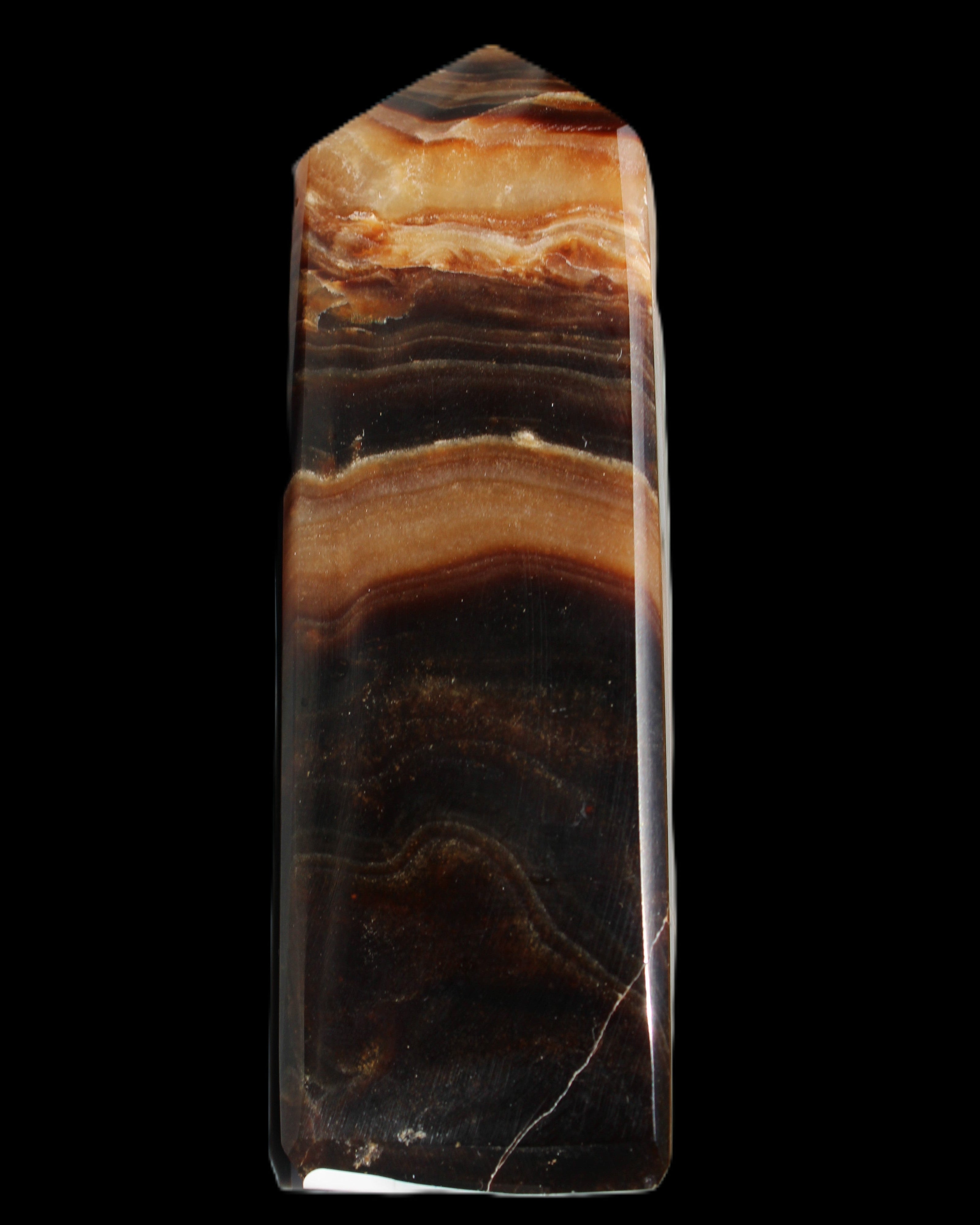 Chocolate Calcite obelisk 103*35mm 268g in sunlight - Rocks and Things Store