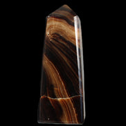 Chocolate Calcite obelisk 103*35mm 268g in sunlight - Rocks and Things Store