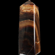 Chocolate Calcite obelisk 103*35mm 268g in sunlight - Rocks and Things Store