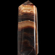 Chocolate Calcite obelisk 103*35mm 268g in sunlight - Rocks and Things Store