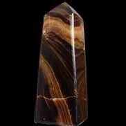 Chocolate Calcite obelisk 103*35mm 268g in sunlight - Rocks and Things Store