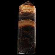 Chocolate Calcite obelisk 103*35mm 268g in sunlight - Rocks and Things Store