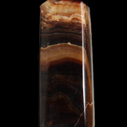 Chocolate Calcite obelisk 103*35mm 268g in sunlight - Rocks and Things Store