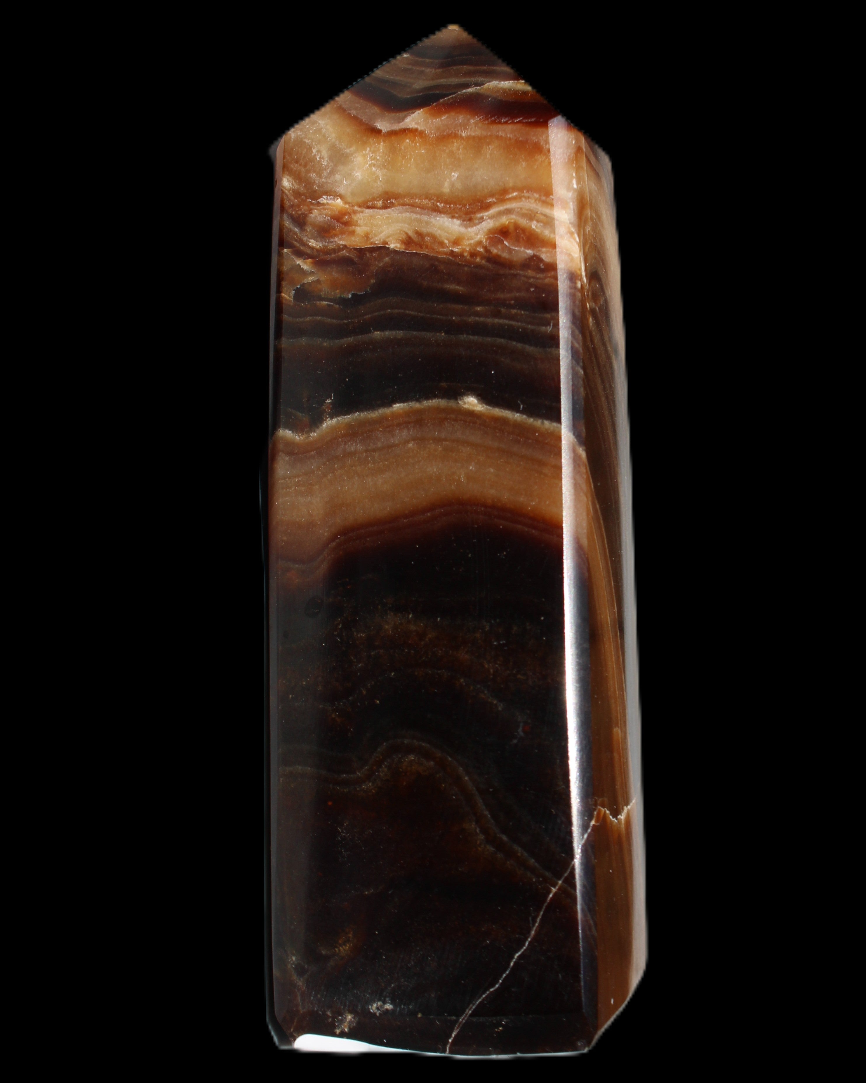 Chocolate Calcite obelisk 103*35mm 268g in sunlight - Rocks and Things Store