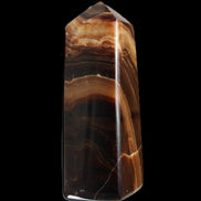 Chocolate Calcite obelisk 103*35mm 268g in sunlight - Rocks and Things Store