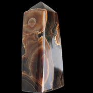 Chocolate Calcite obelisk 97*39mm 243g in sunlight - Rocks and Things Store