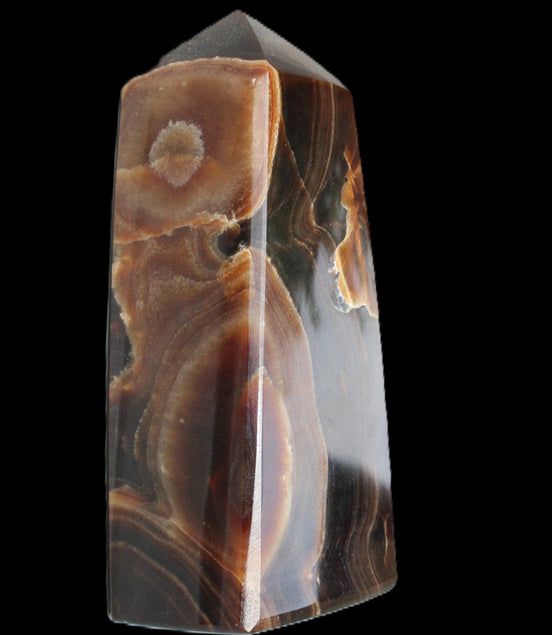 Chocolate Calcite obelisk 97*39mm 243g in sunlight - Rocks and Things Store