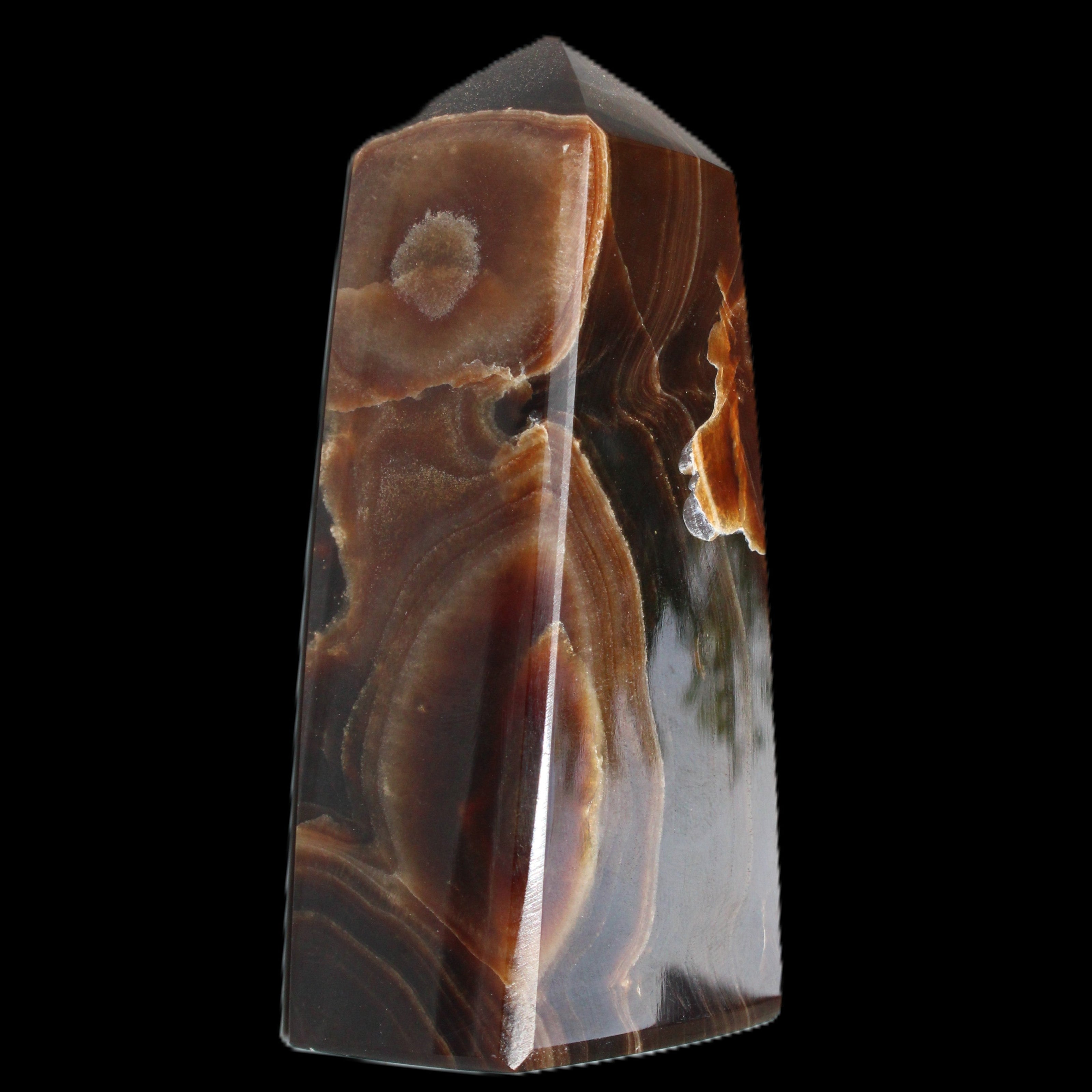 Chocolate Calcite obelisk 97*39mm 243g in sunlight - Rocks and Things Store