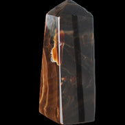 Chocolate Calcite obelisk 97*39mm 243g in sunlight - Rocks and Things Store