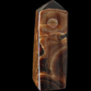 Chocolate Calcite obelisk 97*39mm 243g in sunlight - Rocks and Things Store