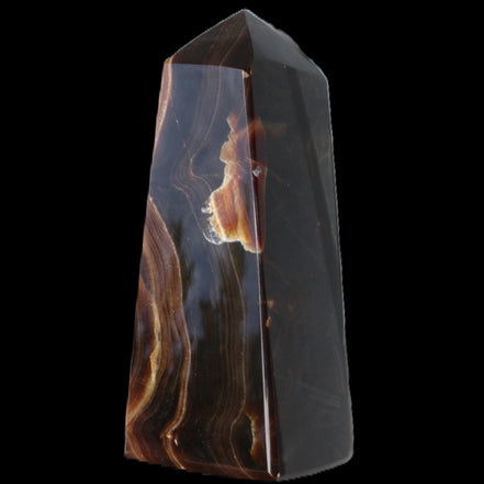 Chocolate Calcite obelisk 97*39mm 243g in sunlight - Rocks and Things Store