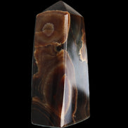 Chocolate Calcite obelisk 97*39mm 243g in sunlight - Rocks and Things Store