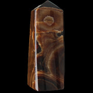 Chocolate Calcite obelisk 97*39mm 243g in sunlight - Rocks and Things Store