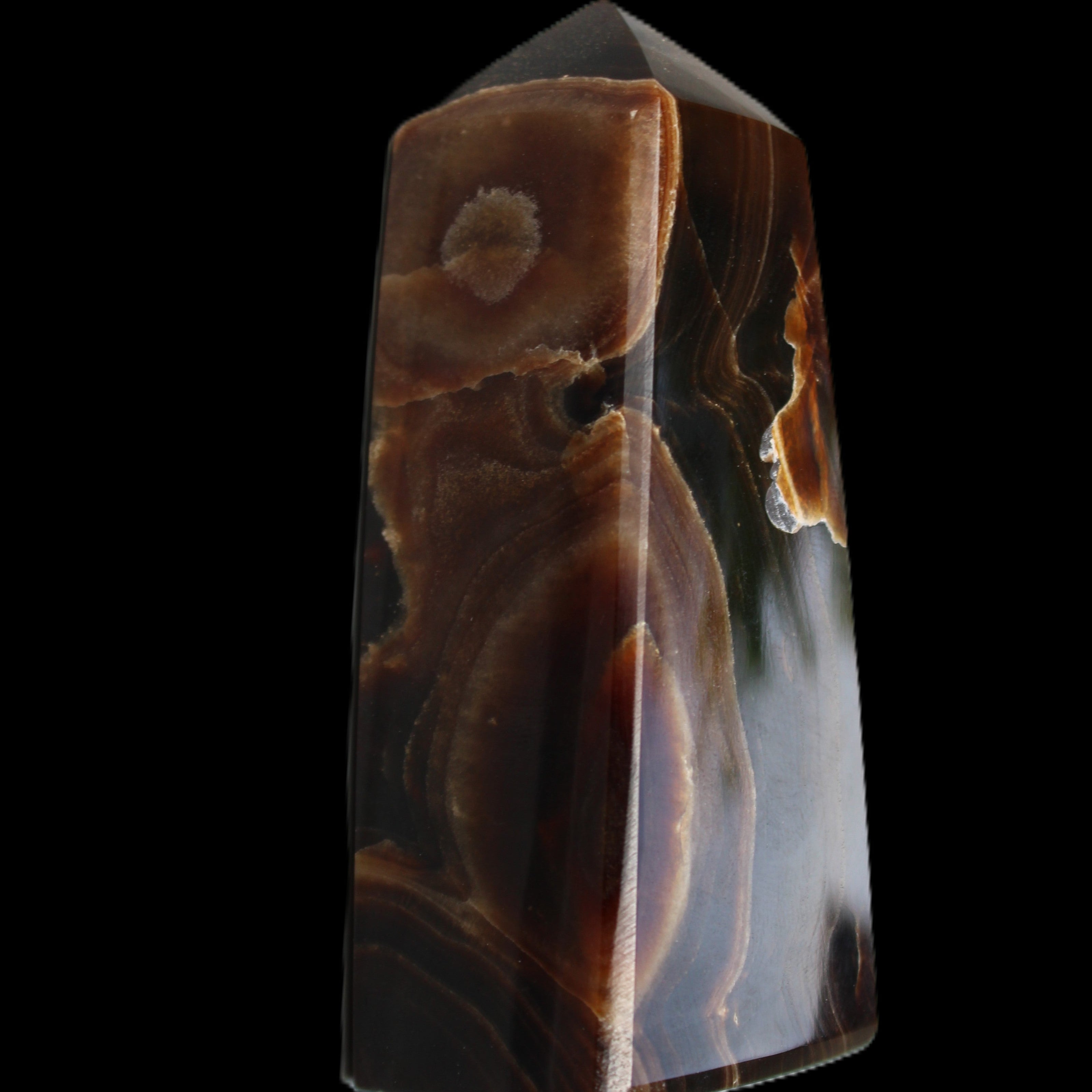 Chocolate Calcite obelisk 97*39mm 243g in sunlight - Rocks and Things Store