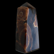 Chocolate Calcite obelisk 97*39mm 243g in sunlight - Rocks and Things Store