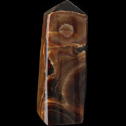 Chocolate Calcite obelisk 97*39mm 243g in sunlight - Rocks and Things Store