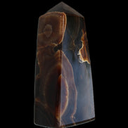 Chocolate Calcite obelisk 97*39mm 243g in sunlight - Rocks and Things Store
