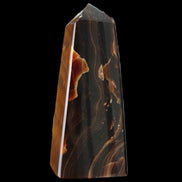 Chocolate Calcite obelisk 97*39mm 243g in sunlight - Rocks and Things Store