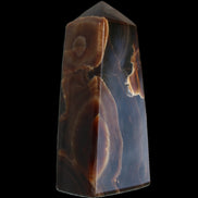 Chocolate Calcite obelisk 97*39mm 243g in sunlight - Rocks and Things Store
