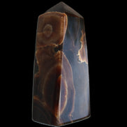 Chocolate Calcite obelisk 97*39mm 243g in sunlight - Rocks and Things Store