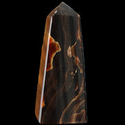 Chocolate Calcite obelisk 97*39mm 243g in sunlight - Rocks and Things Store