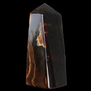 Chocolate Calcite obelisk 97*39mm 243g in sunlight - Rocks and Things Store