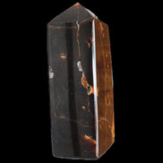 Chocolate Calcite obelisk 100*40mm 286g in sunlight - Rocks and Things Store