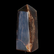 Chocolate Calcite obelisk 100*40mm 286g in sunlight - Rocks and Things Store