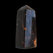 Chocolate Calcite obelisk 100*40mm 286g in sunlight - Rocks and Things Store